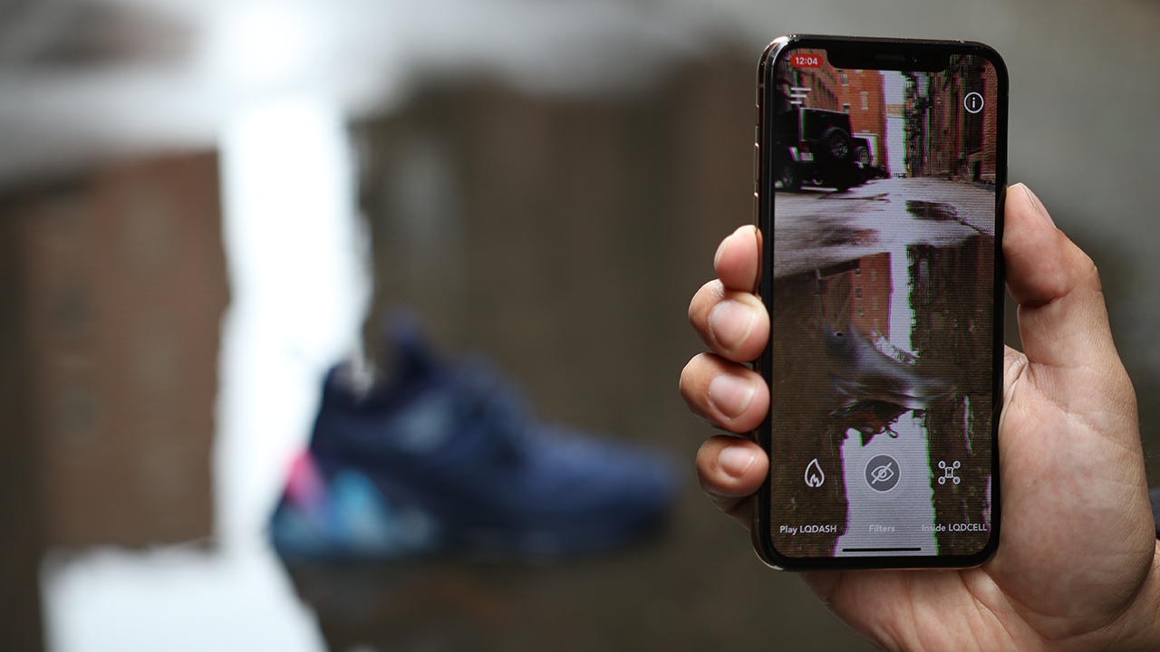 Phone in the foreground shows the cloak AR filter applied to a shoe in the background.